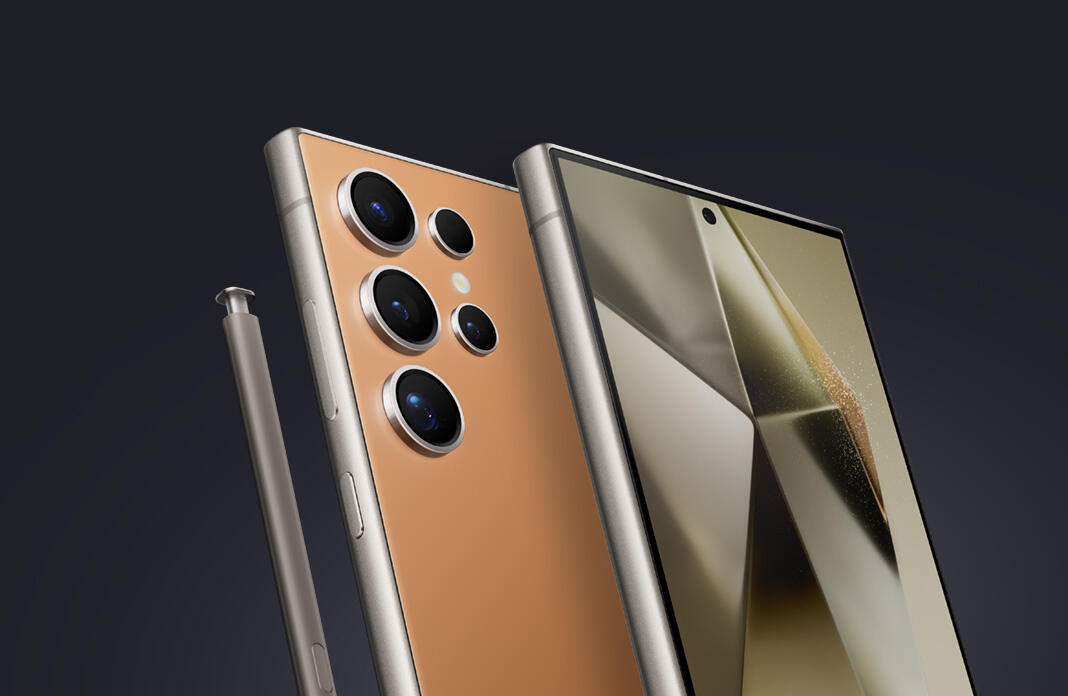 Two smartphones back to back, with a screen and five rear cameras visible and a stylus nearby