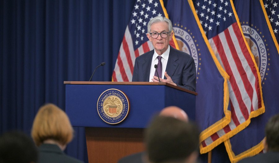 Fed holds interest rates steady, flags rising trade risk