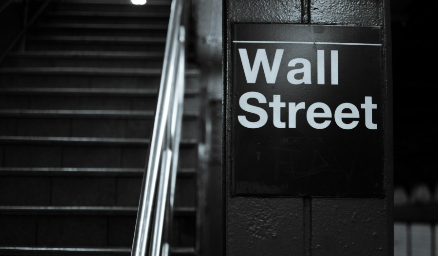 US markets finish mixed on fresh Trump tariff threats