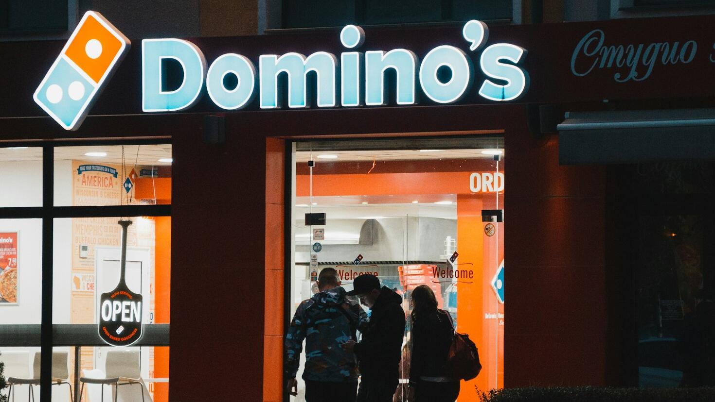 Domino's sales rise despite earnings miss