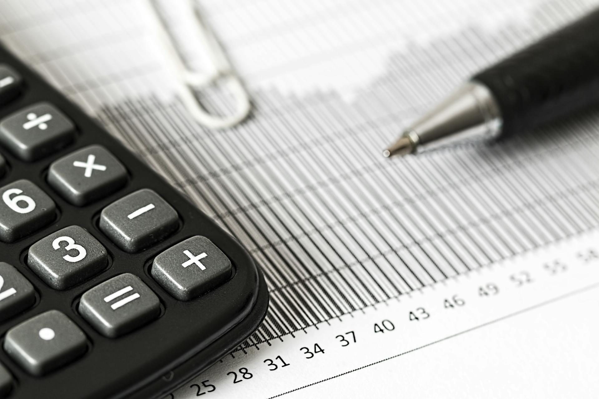 Calculator and pen and chart