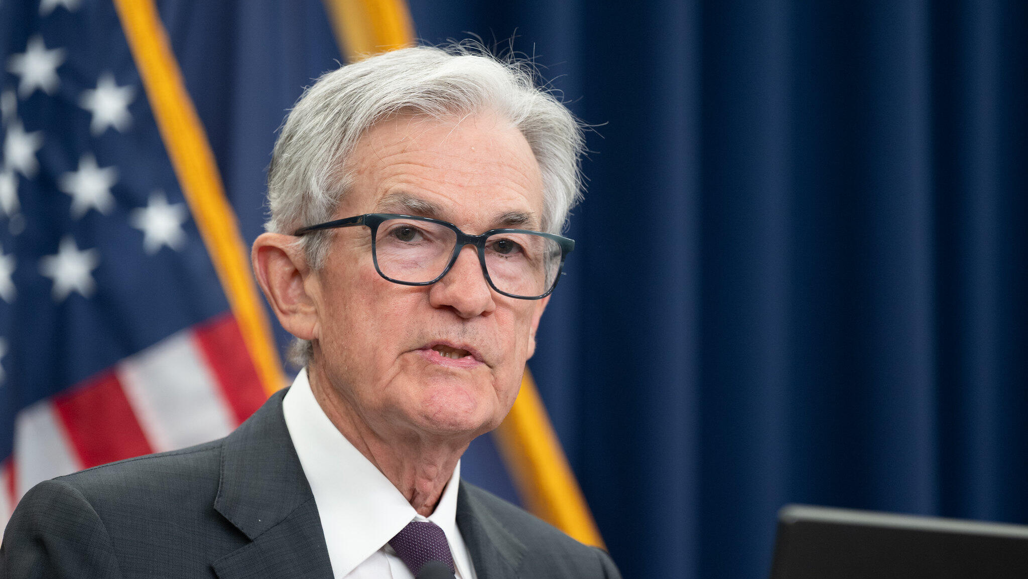Fed holds rates steady despite dissent, Trump criticism
