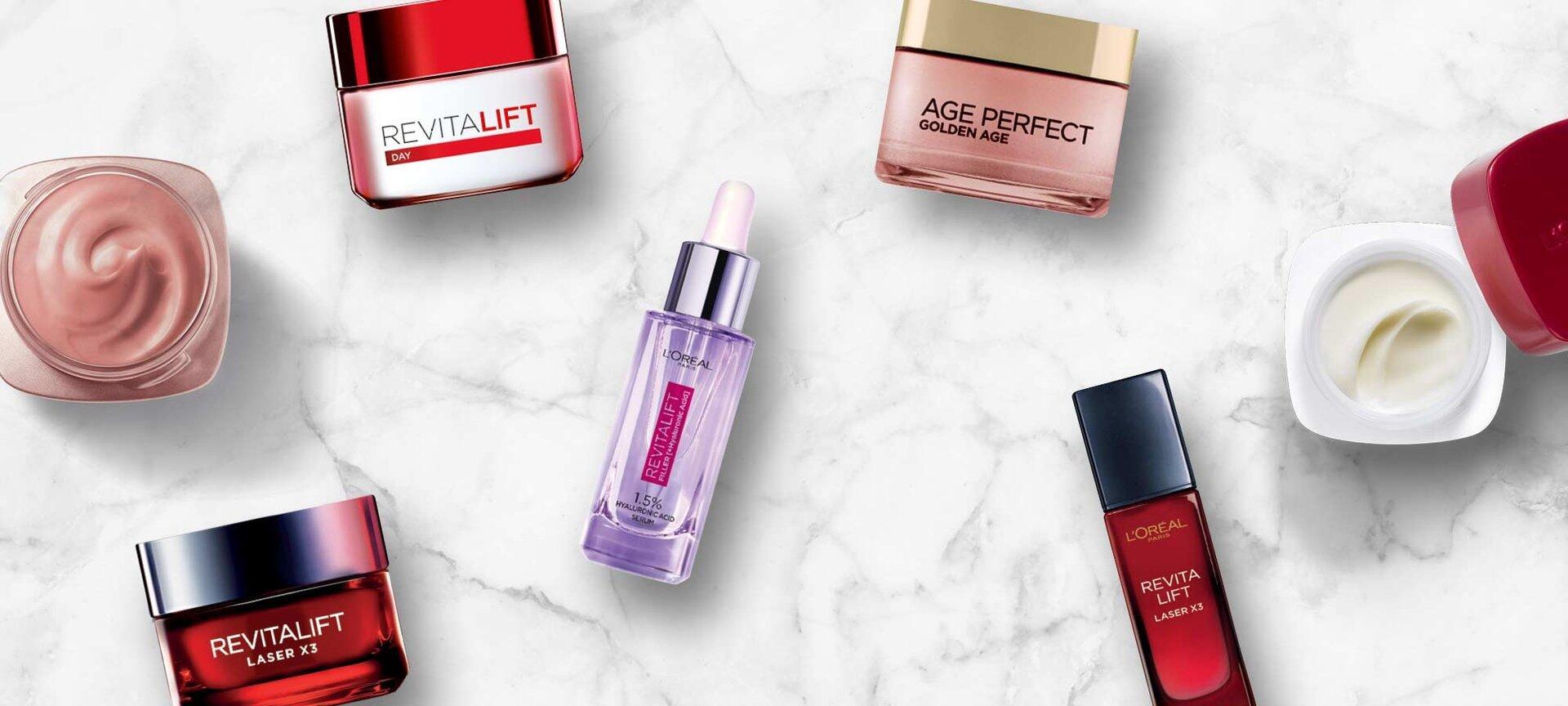 jars and small bottles of L'Oreal products, including Revitalift and Age Perfect