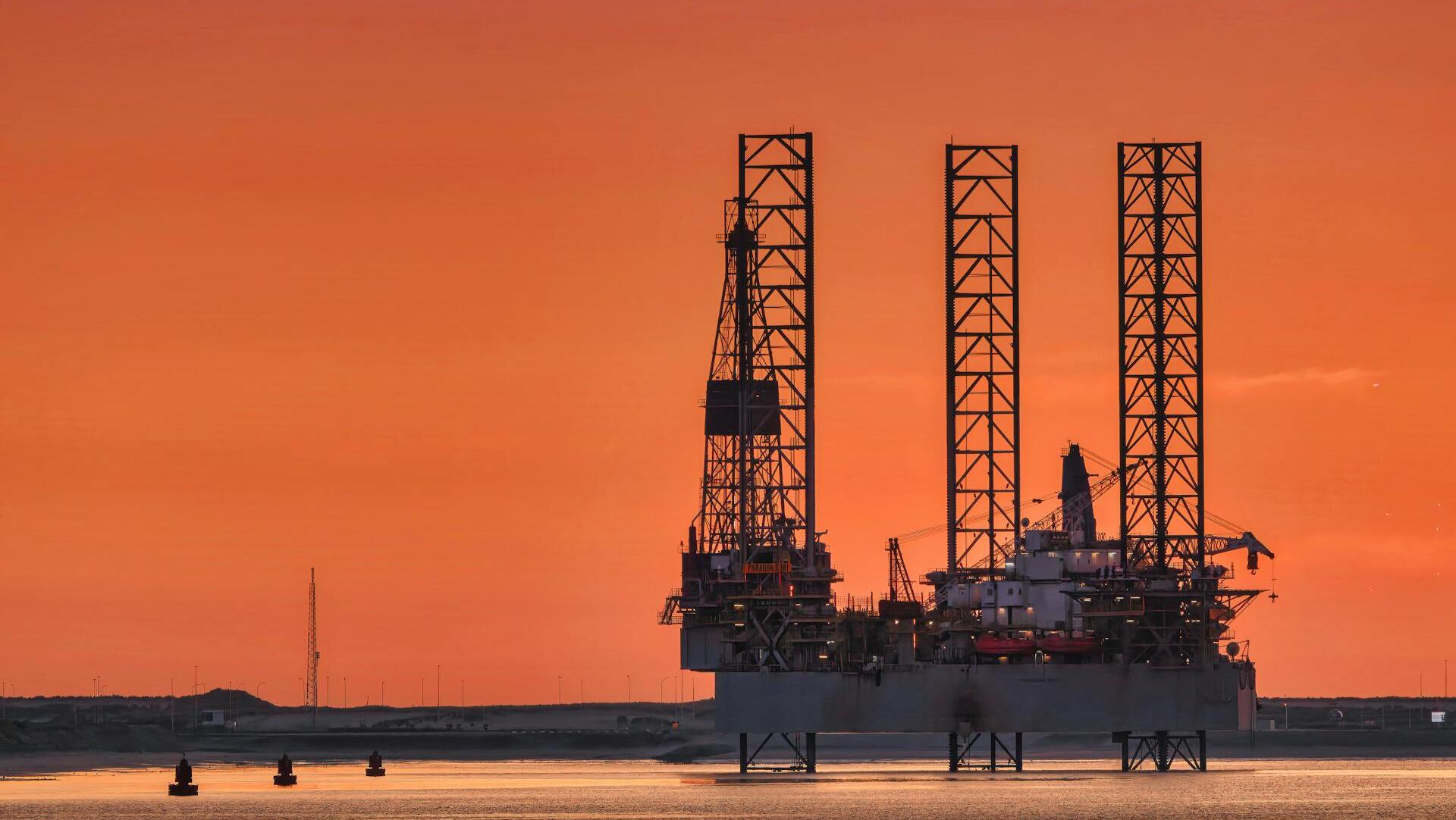 Oil dips on demand worries, set for modest weekly gain