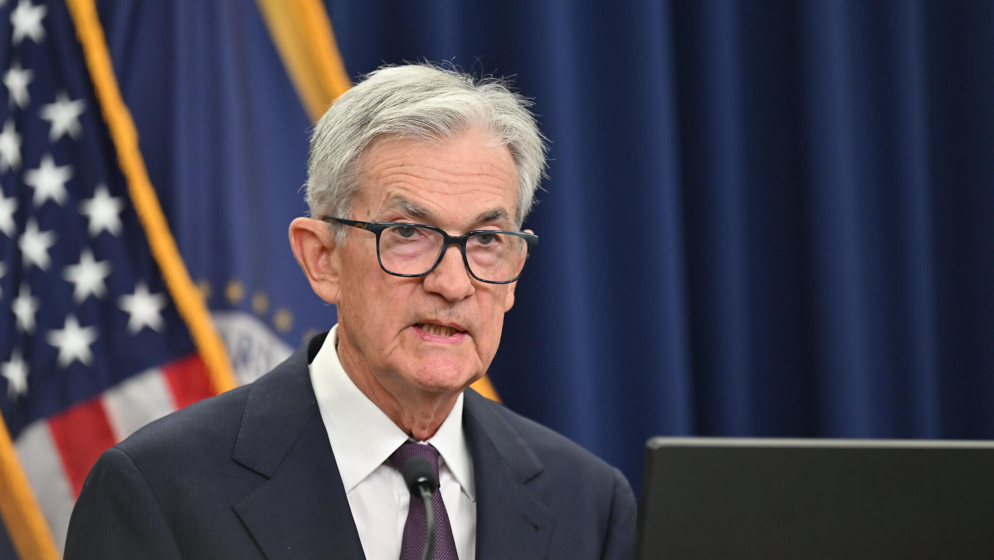 US Fed cuts interest rates, sees more to come