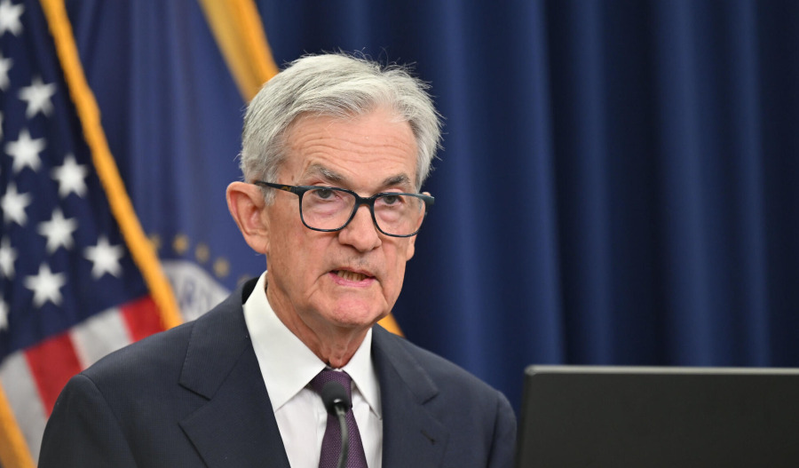 US Fed cuts interest rates, sees more to come