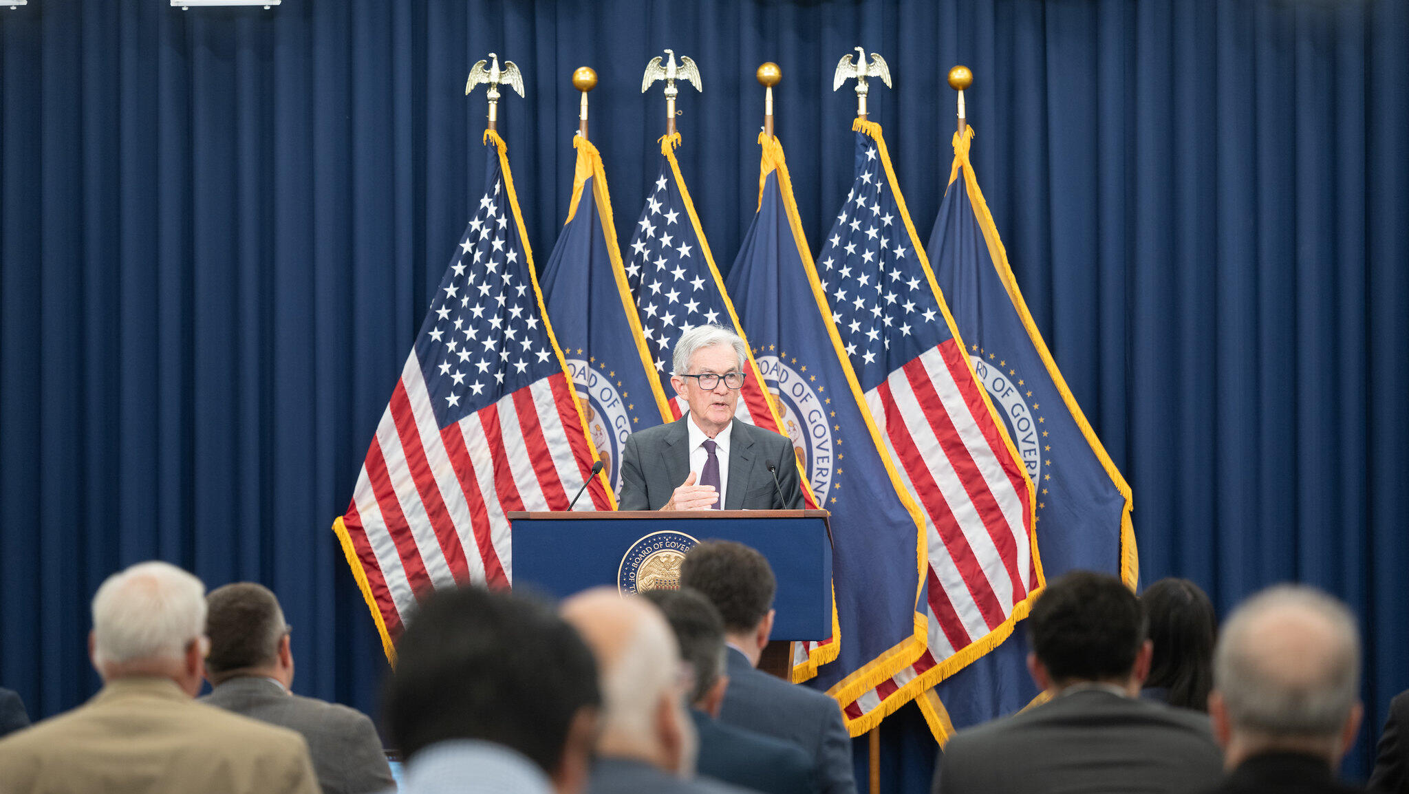 Powell warns on inflation, jobs; Fed split on rate cuts