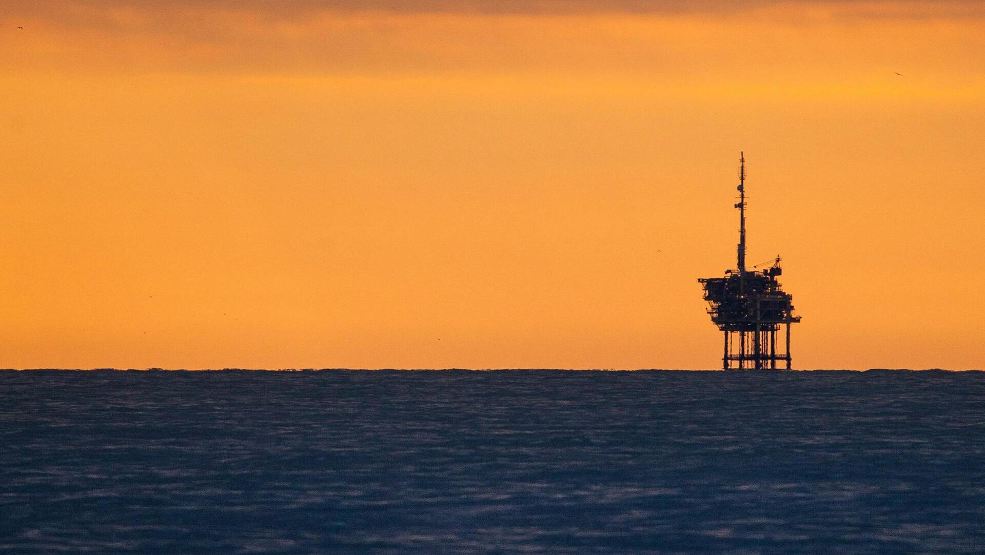 Oil slides as OPEC+ output plans add to surplus fears