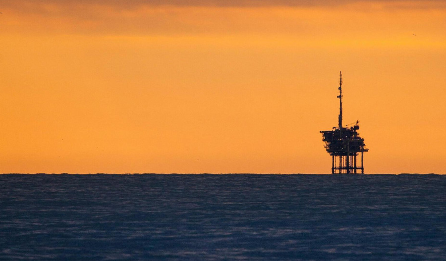 Oil slides as OPEC+ output plans add to surplus fears