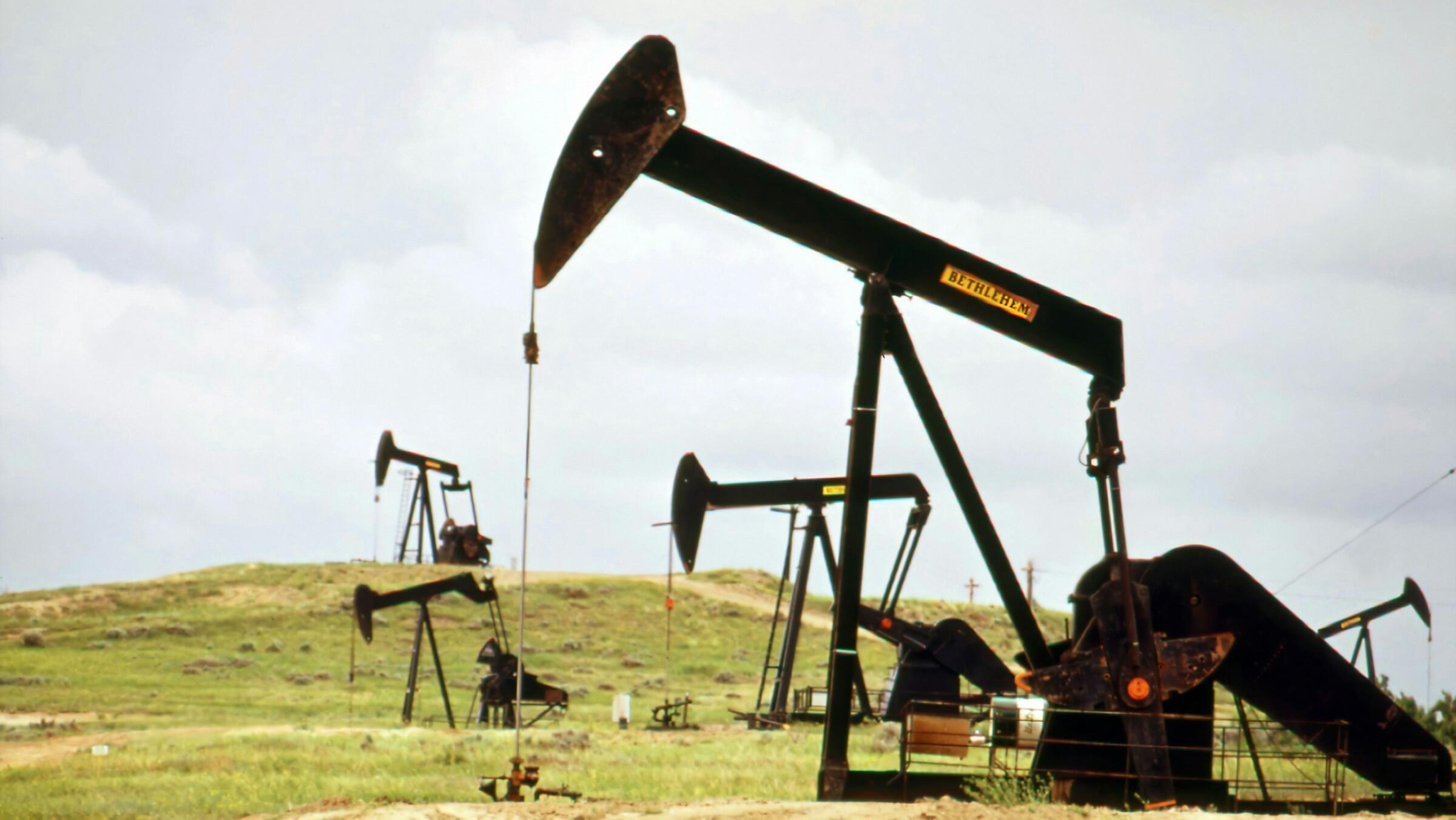 Oil edges higher amid OPEC+ hike, supply glut fears