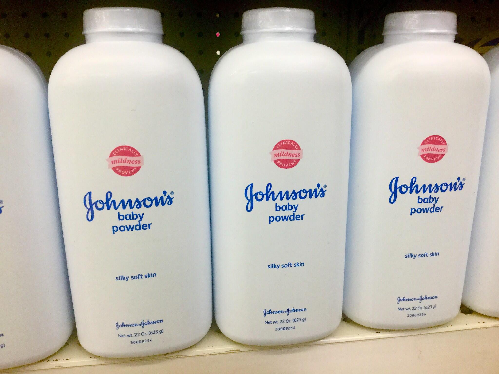 A row of Johnson & Johnson baby powder bottles