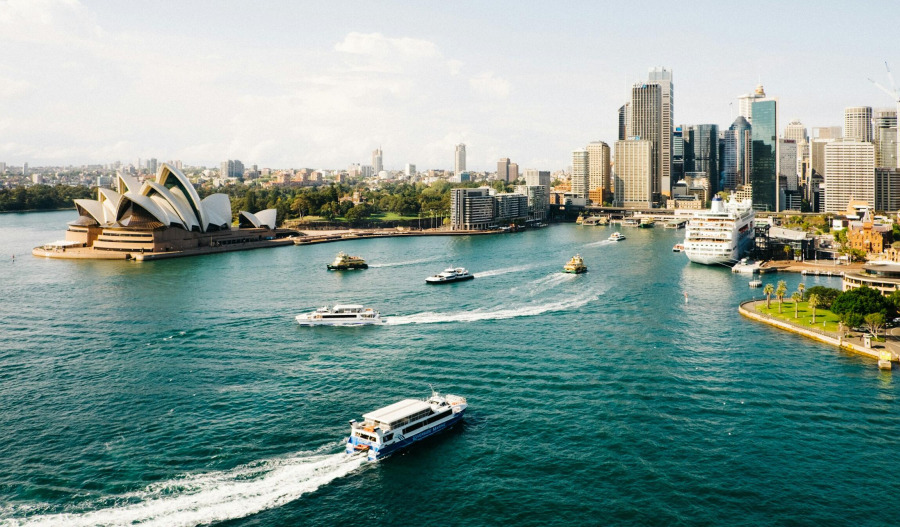 ASX 200 edges higher as banks rally; miners lag
