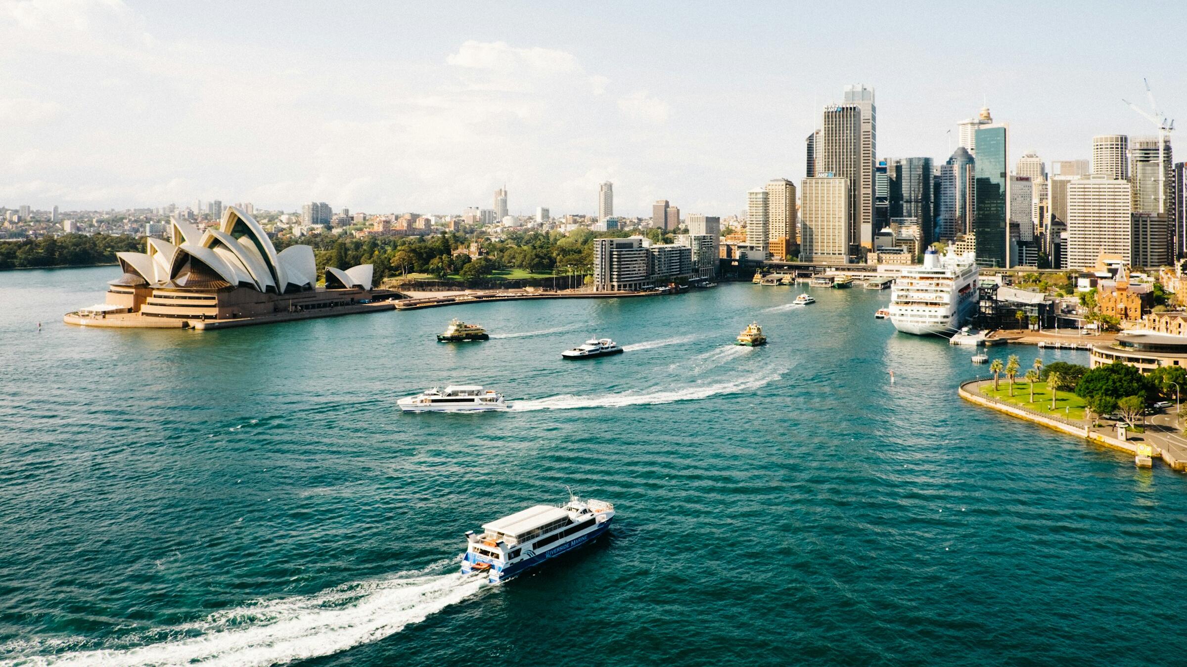 ASX 200 edges higher as banks rally; miners lag