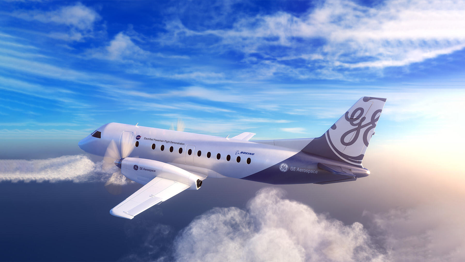 A white plane flying in a blue sky with the "GE" logo on its tail