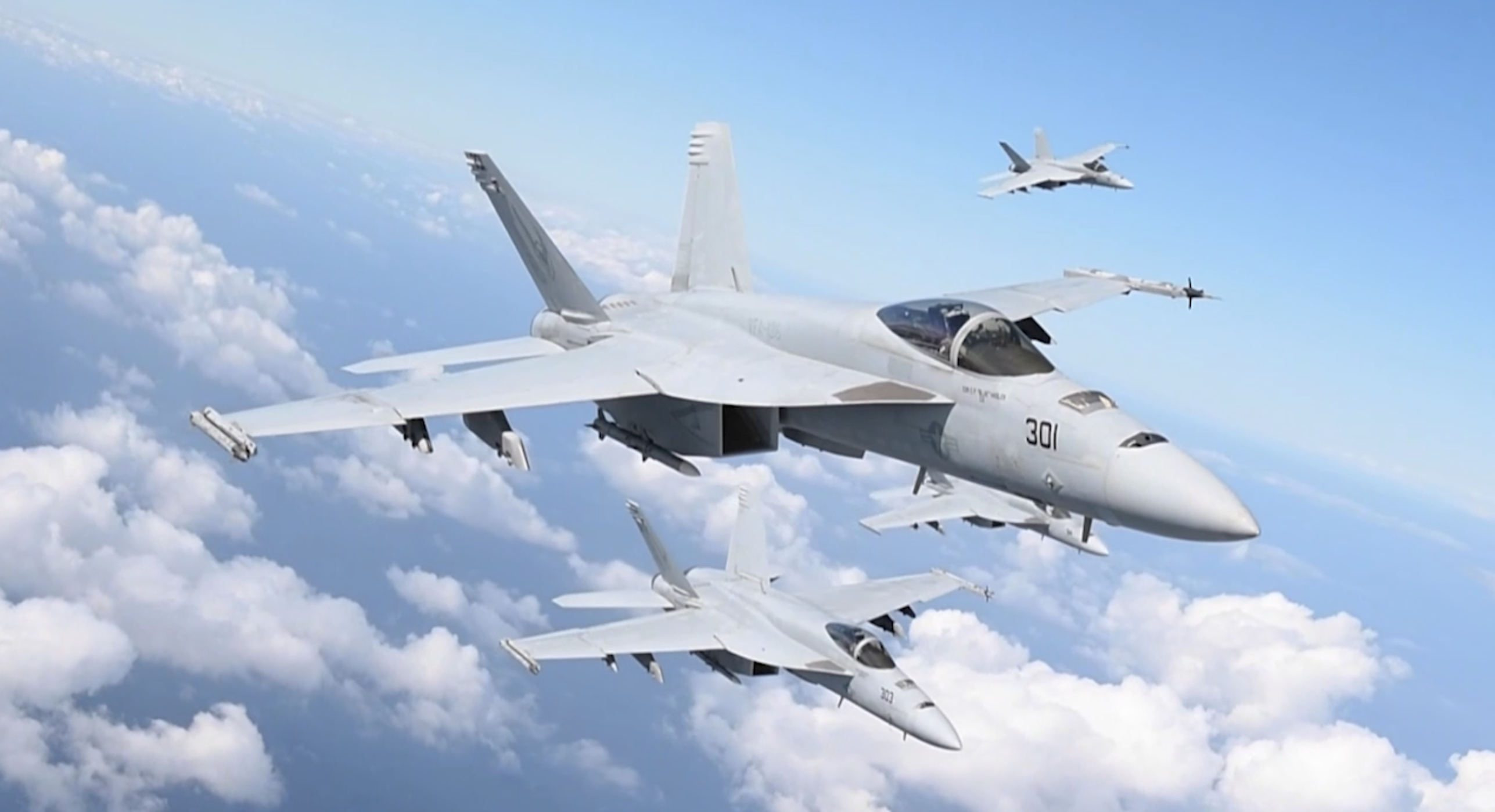 Three warplanes flying over a cloudy blue sky
