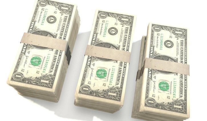 Dollar rises as markets watch Trump's policy impact