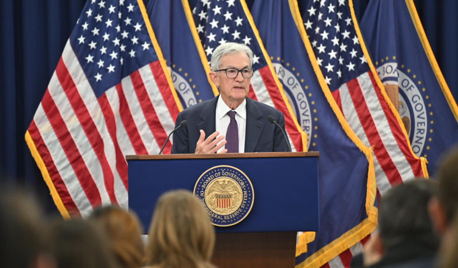 Fed holds rates steady as outlook improves