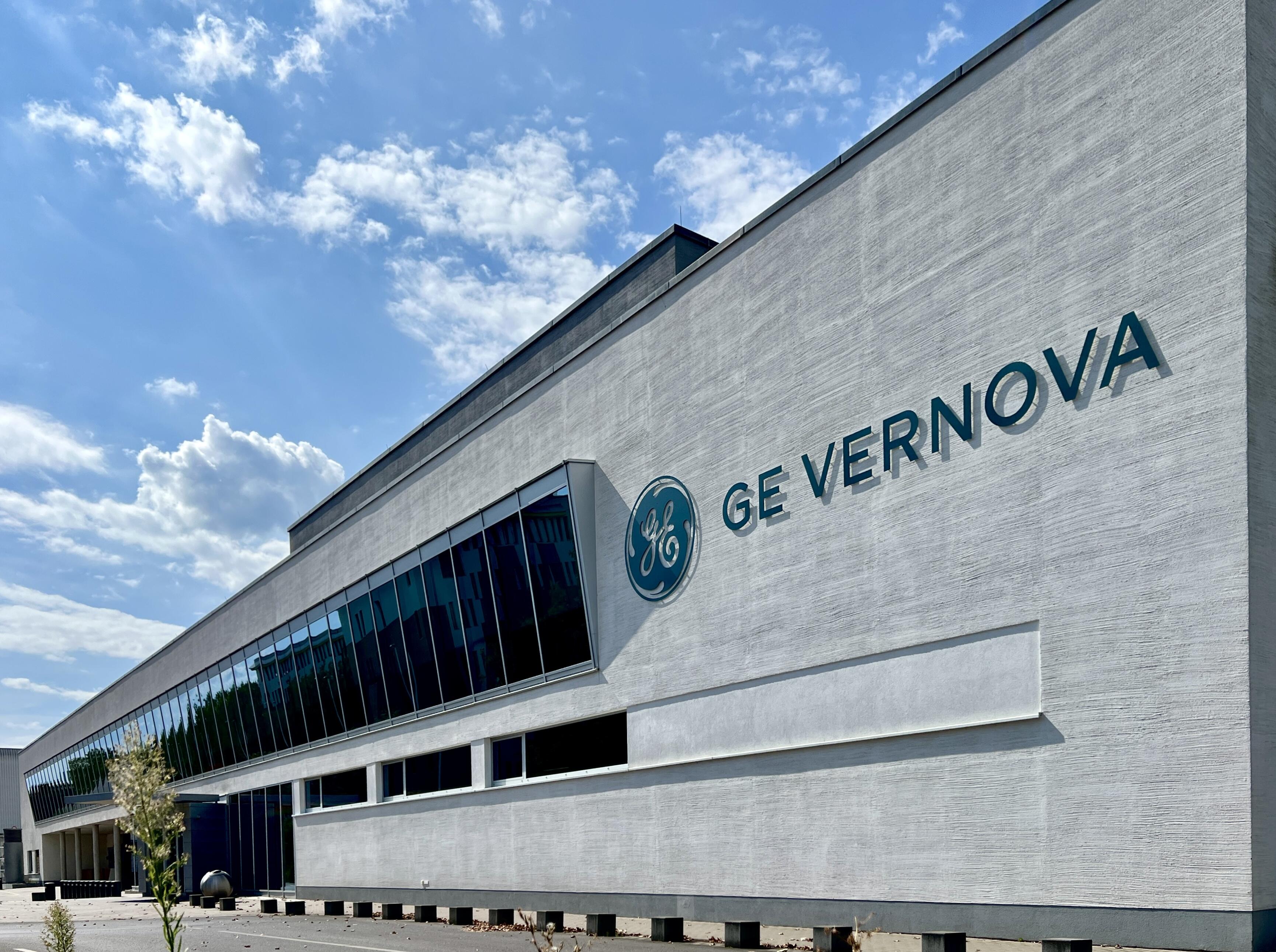A grey concrete building reading "GE VERNOVA"