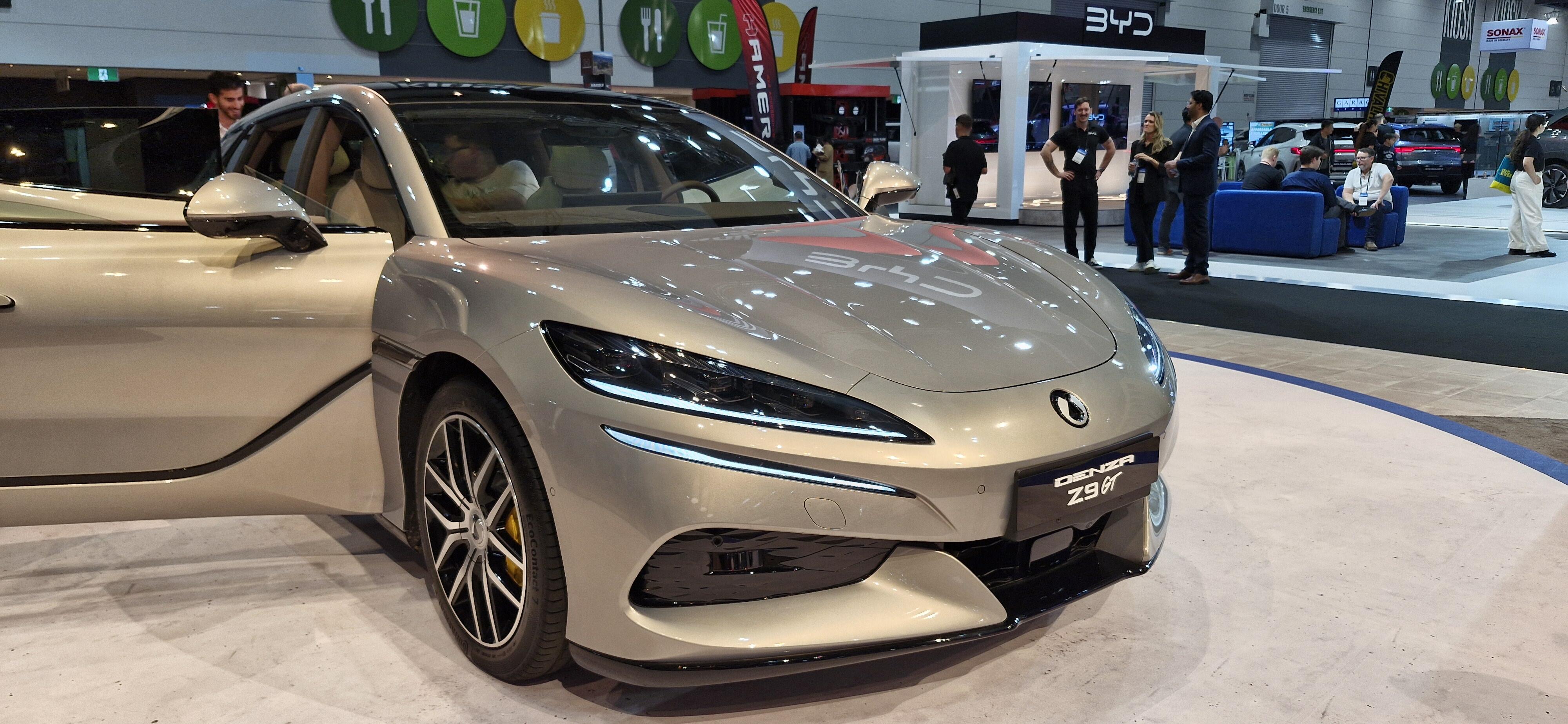 A silver Denza Z9 GT with one front door open