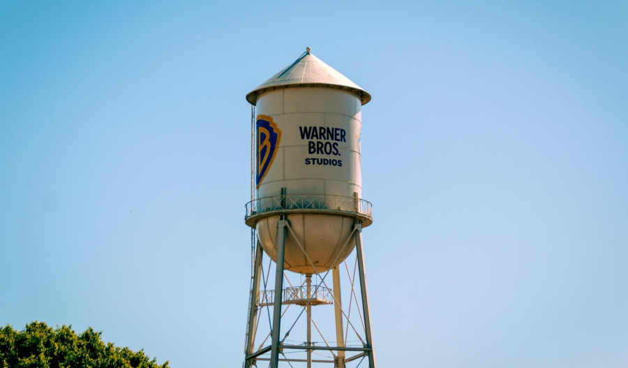 Warner Bros loss widens on acquisition charges