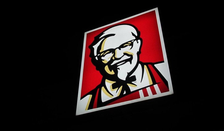 KFC owner serves up lower half year profits