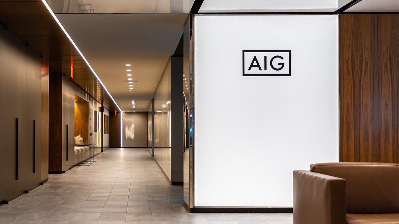 A hallway to the left, the wall to the right says "AIG"