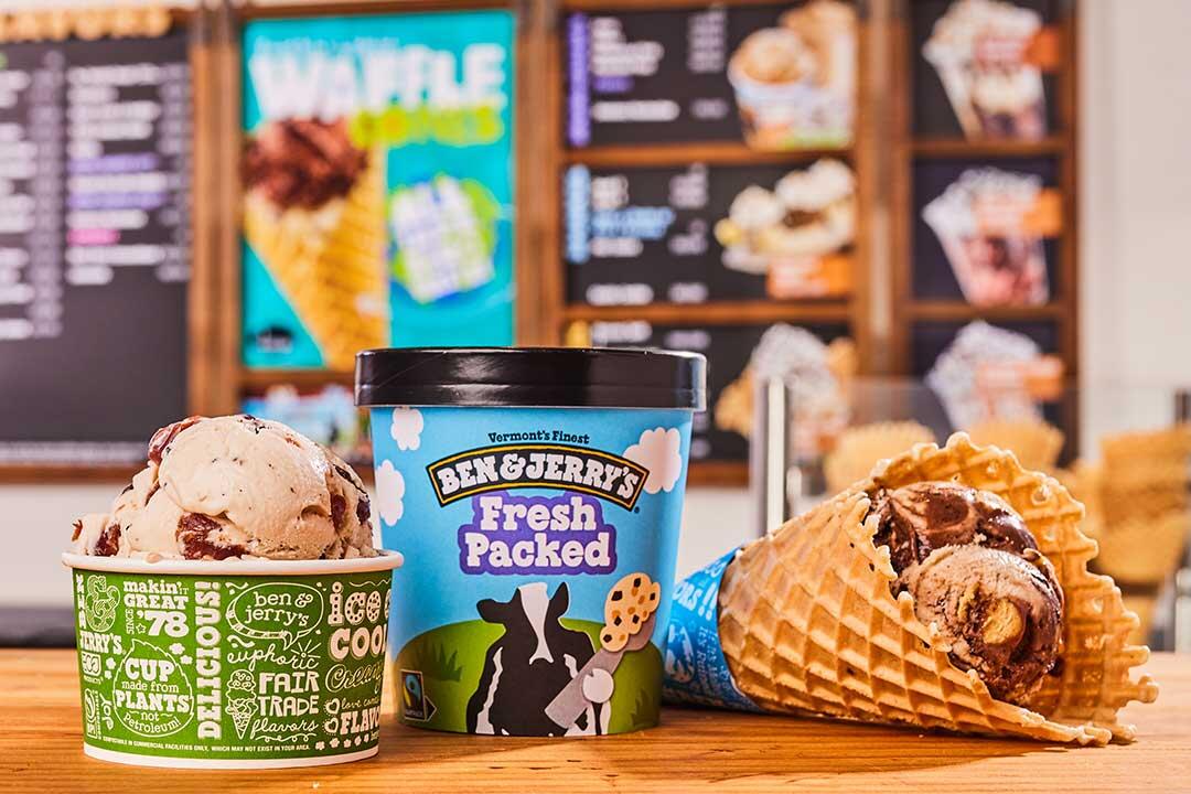 Left to right: a scoop of ice cream in a cup, a pot of Ben & Jerry's Fresh Packed ice cream, a cone with ice cream inside